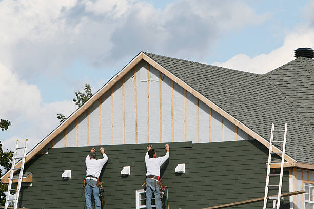 Professional Emergency Siding Repair technician working in Powells Point, NC